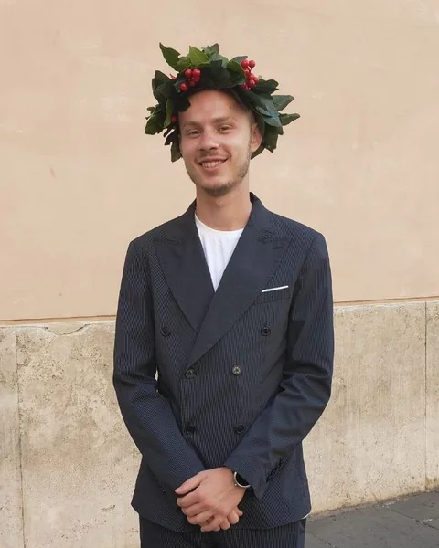 Gabriele on graduation day, wearing the traditional laurel wreath