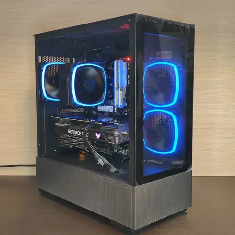 Black build with blue ring fans, a tower cooler and a GeForce RTX card
