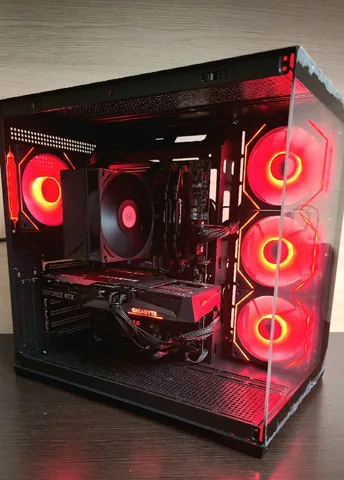 Black dual-chamber build with red fans, a tower air cooler and a GeForce RTX graphics card