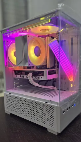 Compact white panoramic build with an RGB air cooler and a white sleeved GPU cable