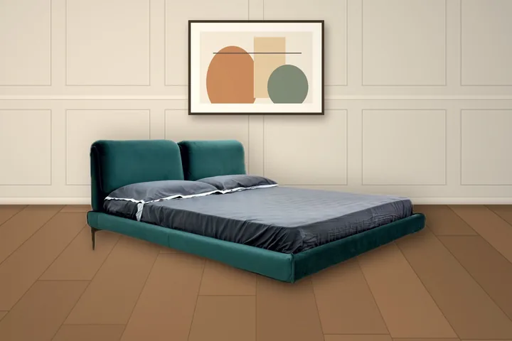 Upholstered bed with a winged headboard